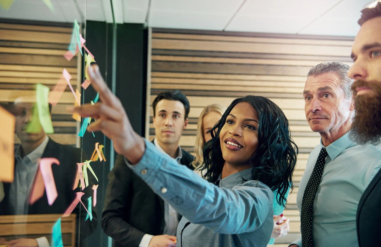 Diverse consulting team collaborating on organizational strategy
